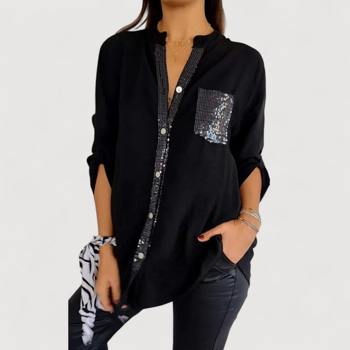 RENNA – BLUUS KIRKADE KANDIDEGA" could be rewritten as "RENNA – Bright Blue Blouse with Candles.