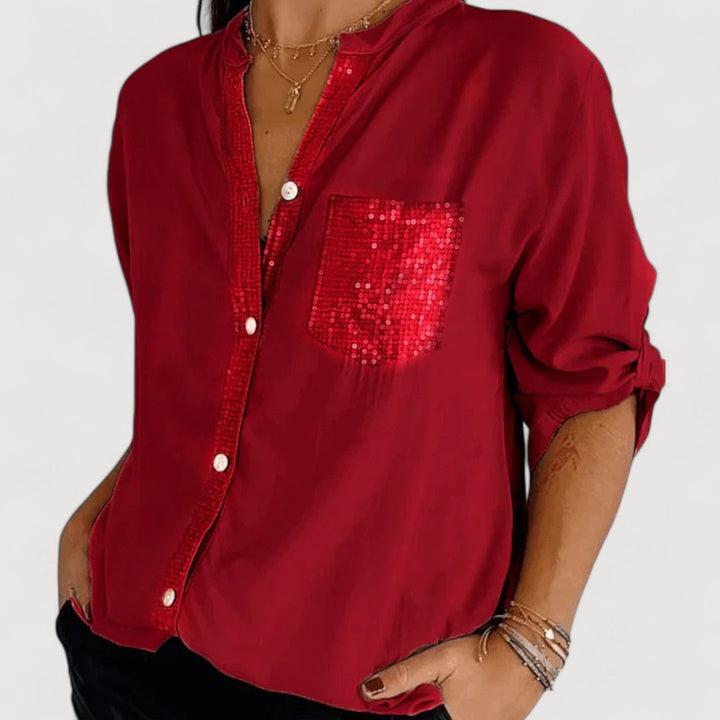 RENNA – BLUUS KIRKADE KANDIDEGA" could be rewritten as "RENNA – Bright Blue Blouse with Candles.