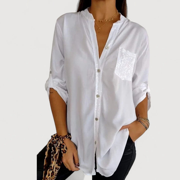 RENNA – BLUUS KIRKADE KANDIDEGA" could be rewritten as "RENNA – Bright Blue Blouse with Candles.
