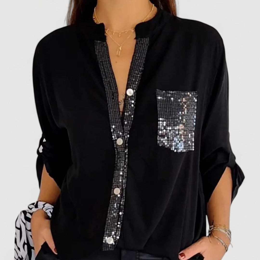 RENNA – BLUUS KIRKADE KANDIDEGA" could be rewritten as "RENNA – Bright Blue Blouse with Candles.