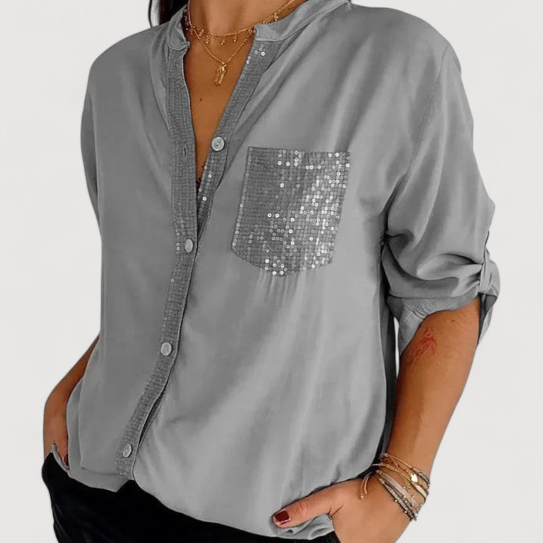 RENNA – BLUUS KIRKADE KANDIDEGA" could be rewritten as "RENNA – Bright Blue Blouse with Candles.