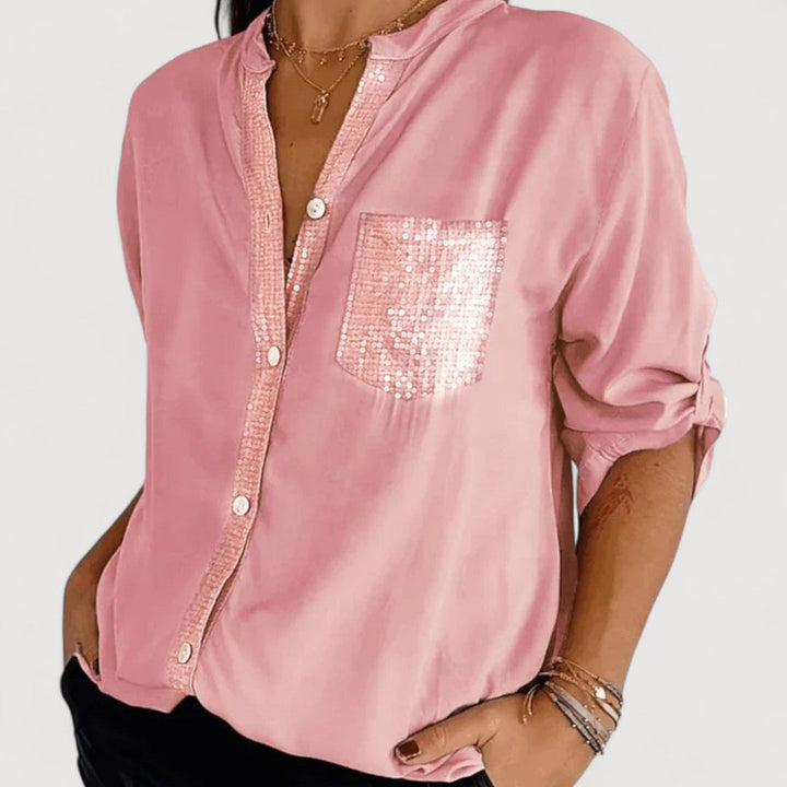 RENNA – BLUUS KIRKADE KANDIDEGA" could be rewritten as "RENNA – Bright Blue Blouse with Candles.