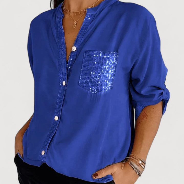 RENNA – BLUUS KIRKADE KANDIDEGA" could be rewritten as "RENNA – Bright Blue Blouse with Candles.