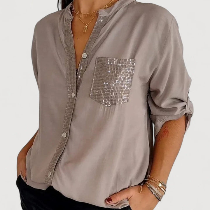 RENNA – BLUUS KIRKADE KANDIDEGA" could be rewritten as "RENNA – Bright Blue Blouse with Candles.