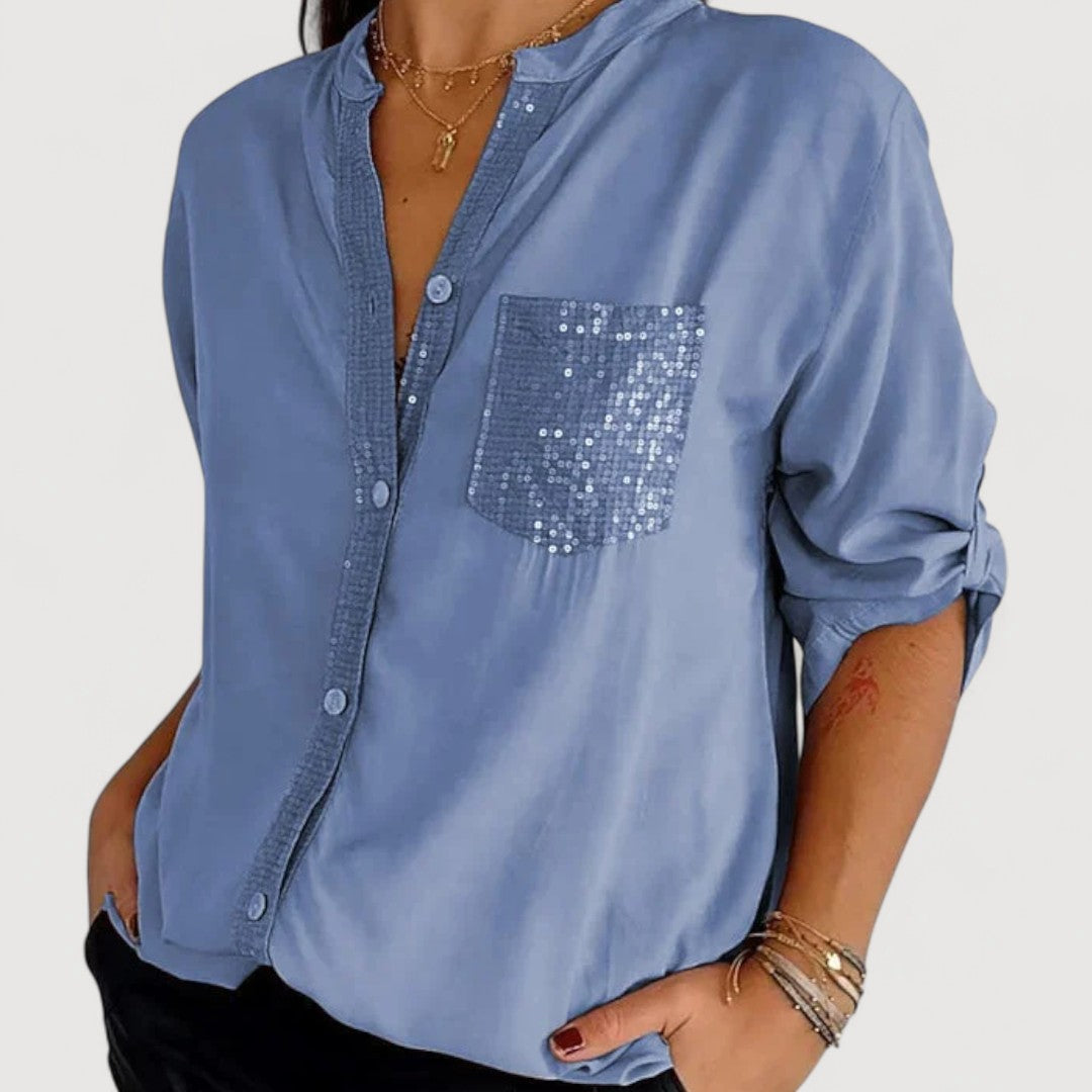RENNA – BLUUS KIRKADE KANDIDEGA" could be rewritten as "RENNA – Bright Blue Blouse with Candles.