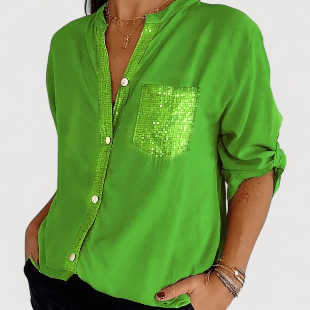 RENNA – BLUUS KIRKADE KANDIDEGA" could be rewritten as "RENNA – Bright Blue Blouse with Candles.