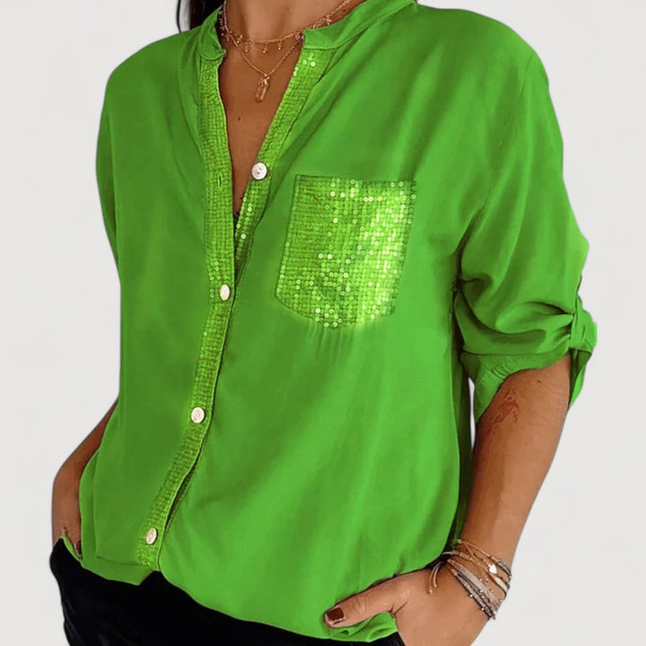 RENNA – BLUUS KIRKADE KANDIDEGA" could be rewritten as "RENNA – Bright Blue Blouse with Candles.